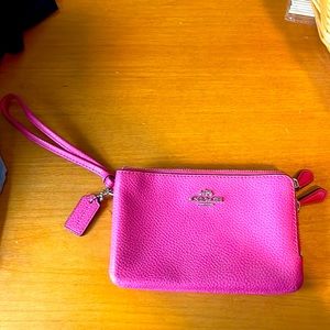 Pink small never used coach clutch.